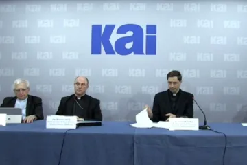 Archbishop Polak, center, at a press conference presenting a report on clerical abuse in Poland, June 28, 2021.
